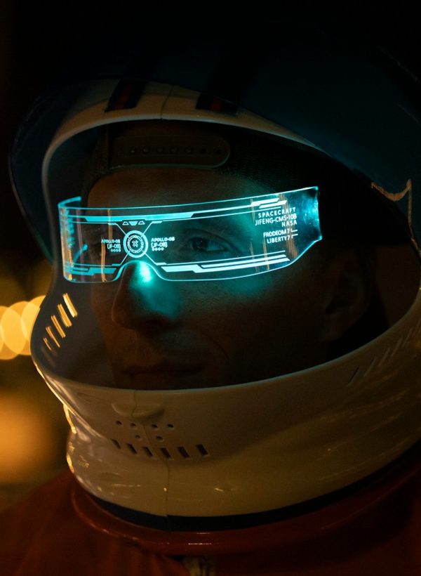 A man wearing a helmet and goggles in the dark